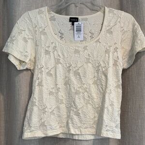 Size 2 Torrid whisper white off white floral and fishnet crop top runs small NWT